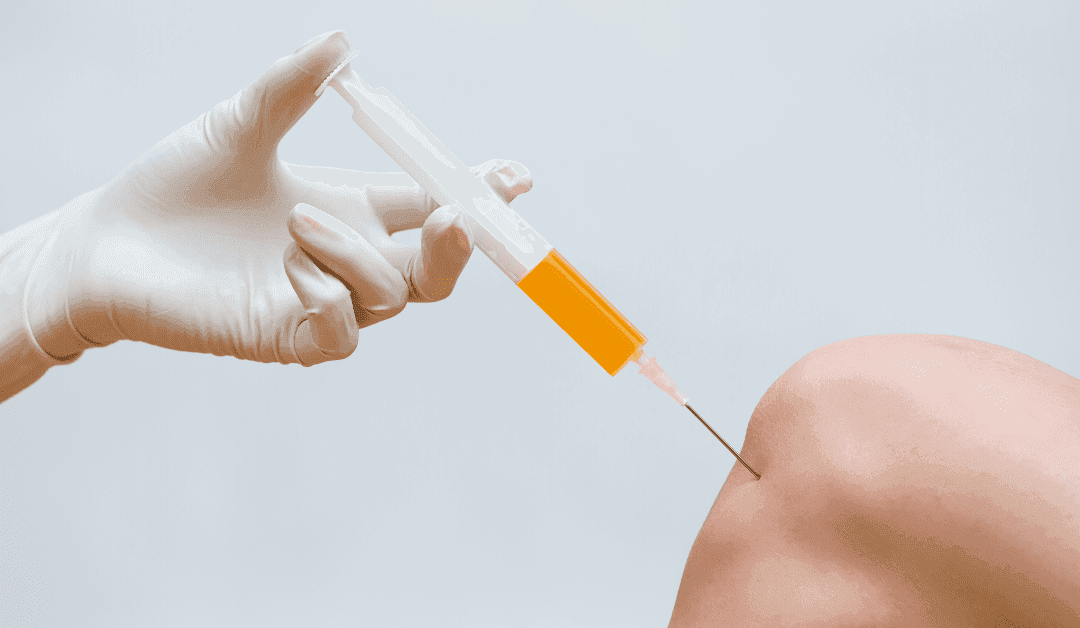 Doctor performing stem cell therapy on knee
